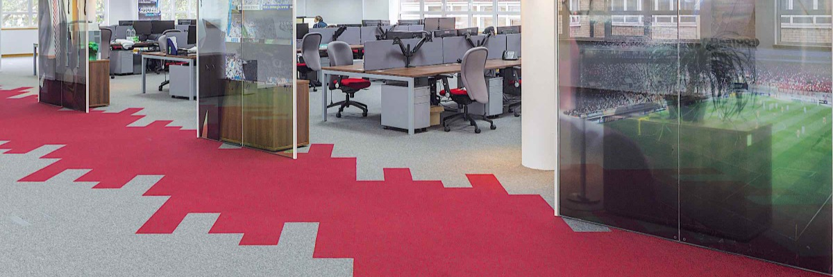 Office image with a carpet featuring red colour blocks